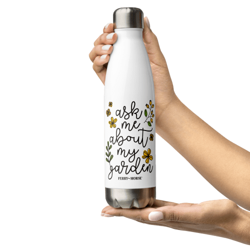 ask me about my garden stainless steel water bottle white 17oz front in hand 2