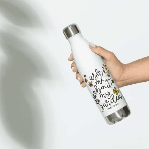 ask me about my garden stainless steel water bottle white 17oz front in hand